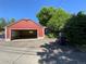 Red garage with an open door and an alley at 1273 S Jackson St, Denver, CO 80210