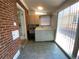 Laundry room with washer, dryer, sink, cabinets, and tile flooring at 1273 S Jackson St, Denver, CO 80210
