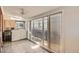 Sunroom featuring tile flooring, ceiling fan, windows and natural light at 1273 S Jackson St, Denver, CO 80210