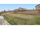 Green, fenced backyard with healthy lawn at 10808 Salida St, Commerce City, CO 80022
