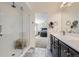 Bright bathroom view of the vanity and shower, with a view of the primary bedroom in the background at 10808 Salida St, Commerce City, CO 80022