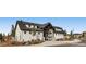 Beautiful community clubhouse with modern farmhouse architecture and professional landscaping at 10808 Salida St, Commerce City, CO 80022