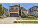 Charming two-story home with modern exterior, tidy landscaping, and a convenient two-car garage at 10808 Salida St, Commerce City, CO 80022