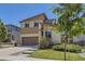 Two-story home featuring a two-car garage, neutral siding, and well-maintained landscaping at 10808 Salida St, Commerce City, CO 80022