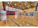 Spacious gymnasium featuring a hardwood court, high ceilings, and ample natural light at 10808 Salida St, Commerce City, CO 80022