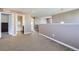 Hallway featuring neutral colored walls, carpet flooring, and entryways to other rooms at 10808 Salida St, Commerce City, CO 80022