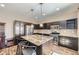 Modern kitchen featuring granite countertops, stainless steel appliances, and a functional island at 10808 Salida St, Commerce City, CO 80022