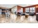 Open-concept living room with a leather sofa, wooden flooring, and modern furniture at 10808 Salida St, Commerce City, CO 80022