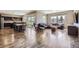 Open-concept living area boasts hardwood floors, stylish furniture, and abundant natural light at 10808 Salida St, Commerce City, CO 80022
