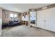 This cozy living room space features a comfortable blue sofa and is adjacent to a bedroom at 10808 Salida St, Commerce City, CO 80022