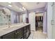 The main bathroom has a double vanity and a sliding barn door to the walk-in closet at 10808 Salida St, Commerce City, CO 80022