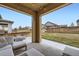 Inviting outdoor patio with comfortable seating and a view of the fenced backyard at 10808 Salida St, Commerce City, CO 80022