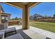 Cozy covered patio with comfortable seating, perfect for outdoor relaxation and entertaining at 10808 Salida St, Commerce City, CO 80022