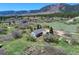 An aerial view of the home surrounded by trees and open grassland at 18045 Sunburst Dr, Monument, CO 80132