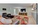 Cozy basement area with comfortable seating, a large TV, and a decorative rug, perfect for relaxing at 18045 Sunburst Dr, Monument, CO 80132