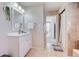 Well-lit bathroom with updated vanity and fixtures, earth-tone tile work, and a walk-in shower at 18045 Sunburst Dr, Monument, CO 80132