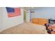 Comfortable bedroom featuring carpeted floor, baseball decor, and ample closet space for storage at 18045 Sunburst Dr, Monument, CO 80132