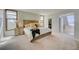 Serene bedroom with a large bed, side tables, and a glimpse into a walk-in closet for ample storage at 18045 Sunburst Dr, Monument, CO 80132