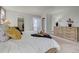Cozy bedroom featuring a comfortable bed, dresser, walk-in closet, and plenty of natural light at 18045 Sunburst Dr, Monument, CO 80132
