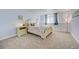 Charming bedroom with soft pastel colors, plush carpet, and a cozy bed, perfect for relaxation at 18045 Sunburst Dr, Monument, CO 80132