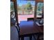Dining room featuring a rustic wood table with chairs and large sliding glass doors to the deck at 18045 Sunburst Dr, Monument, CO 80132
