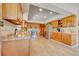 Well-lit kitchen featuring wood cabinets, stainless steel appliances, and ample counter space for cooking at 18045 Sunburst Dr, Monument, CO 80132