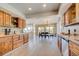 Open kitchen and dining area with wood cabinets, modern appliances, and plenty of natural light at 18045 Sunburst Dr, Monument, CO 80132