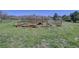 Rustic wood fence and entrance in a grassy outdoor area at 18045 Sunburst Dr, Monument, CO 80132