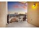 Balcony featuring metal railings and views of the cityscape under a colorful sky at 2240 N Clay St # 501, Denver, CO 80211
