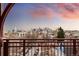 Stunning balcony view of the city skyline and vibrant sunset at 2240 N Clay St # 501, Denver, CO 80211