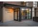 Street level view of brick condo entrance with glass entryway and visible 'Riverclay Residences' signage at 2240 N Clay St # 501, Denver, CO 80211
