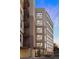 Modern building exterior with brick accents, large windows, and private balconies for many of the units at 2240 N Clay St # 501, Denver, CO 80211