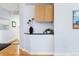 Hallway area with storage cabinets, a black countertop, and decorative plants in a vase and pot at 2240 N Clay St # 501, Denver, CO 80211