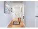 Entry hall with hardwood flooring leads to rooms in the unit at 2240 N Clay St # 501, Denver, CO 80211