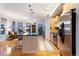 Open kitchen and living room with modern design, breakfast bar, stainless appliances and hardwood floors at 2240 N Clay St # 501, Denver, CO 80211