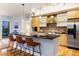 Modern kitchen with sleek countertops, stainless steel appliances, and adjacent outdoor patio access at 2240 N Clay St # 501, Denver, CO 80211