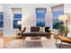 Comfortable living room featuring modern decor, a cozy sofa, and ample natural light at 2240 N Clay St # 501, Denver, CO 80211