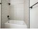 Modern bathroom featuring stylish patterned tiles and black matte hardware fixtures at 2809 Syracuse Ct # 129, Denver, CO 80238