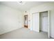 This bright bedroom boasts natural light, neutral walls and a closet at 2809 Syracuse Ct # 129, Denver, CO 80238