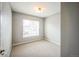 Cozy bedroom with neutral carpet and a large window offering plenty of natural light at 2809 Syracuse Ct # 129, Denver, CO 80238