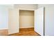 This walk-in closet boasts hardwood-style flooring and room for storage at 2809 Syracuse Ct # 129, Denver, CO 80238