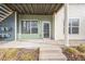 Inviting condo entrance with concrete patio, modern door and convenient access, creating a welcoming arrival experience at 2809 Syracuse Ct # 129, Denver, CO 80238