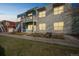 Modern condo building with two-story design and private balcony, showcasing contemporary architecture and inviting curb appeal at 2809 Syracuse Ct # 129, Denver, CO 80238