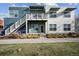 Modern condo building with two-story design and private balcony, showcasing contemporary architecture and inviting curb appeal at 2809 Syracuse Ct # 129, Denver, CO 80238