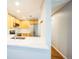 Bright, renovated kitchen with stainless steel appliances, light wood cabinets, and white countertops at 2809 Syracuse Ct # 129, Denver, CO 80238
