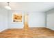 Bright living room with hardwood floors, open to kitchen, offering a spacious and modern living experience at 2809 Syracuse Ct # 129, Denver, CO 80238
