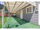 Cozy covered back porch overlooking the green backyard at 2205 S Irving St, Denver, CO 80219