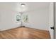 Bright bedroom featuring gleaming hardwood floors and fresh paint at 2205 S Irving St, Denver, CO 80219
