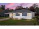 Charming single story home featuring a carport and well-maintained front yard at 2205 S Irving St, Denver, CO 80219
