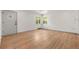 Bright living room boasts gleaming hardwood floors, fresh paint, and abundant natural light at 2205 S Irving St, Denver, CO 80219